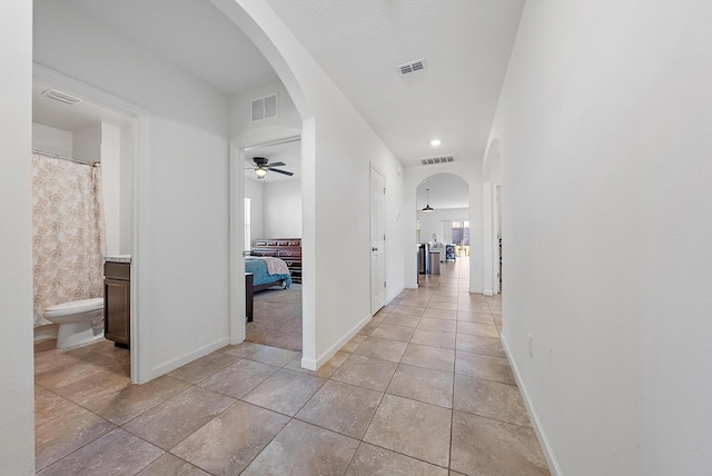 corridor with light tile patterned floors