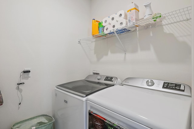 laundry area featuring washing machine and clothes dryer