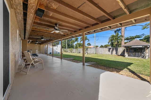 view of patio featuring a gazebo and a shed