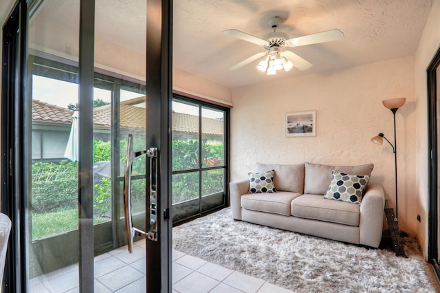 interior space with ceiling fan