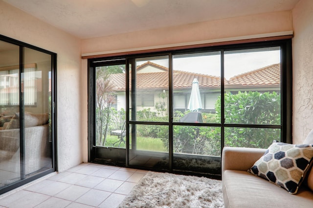 interior space with plenty of natural light and light tile patterned flooring