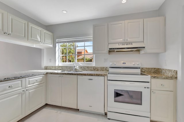 kitchen featuring white cabinetry and white appliances