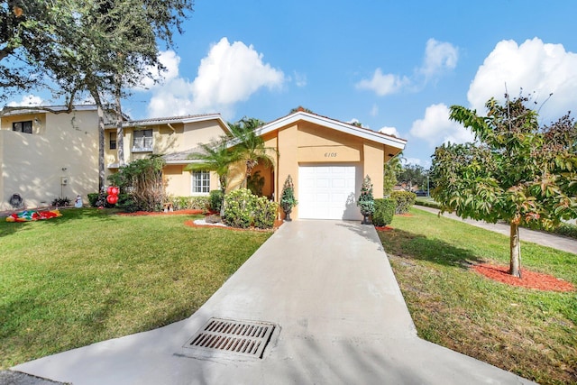 mediterranean / spanish home with a front yard and a garage