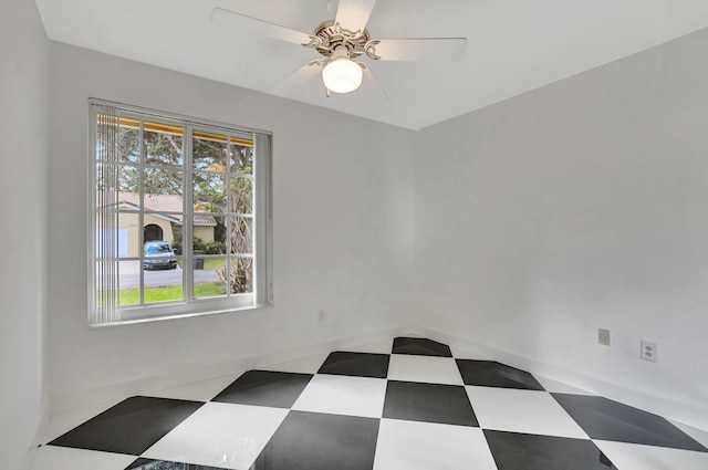 spare room with ceiling fan