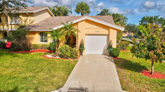 mediterranean / spanish-style home featuring a front yard and a garage