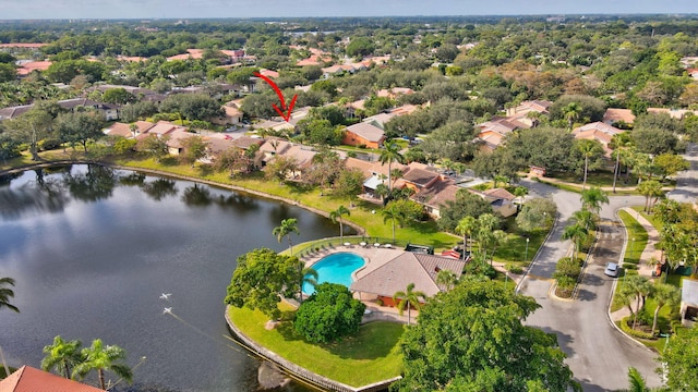 birds eye view of property with a water view