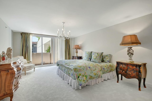 bedroom with access to outside, light carpet, and an inviting chandelier