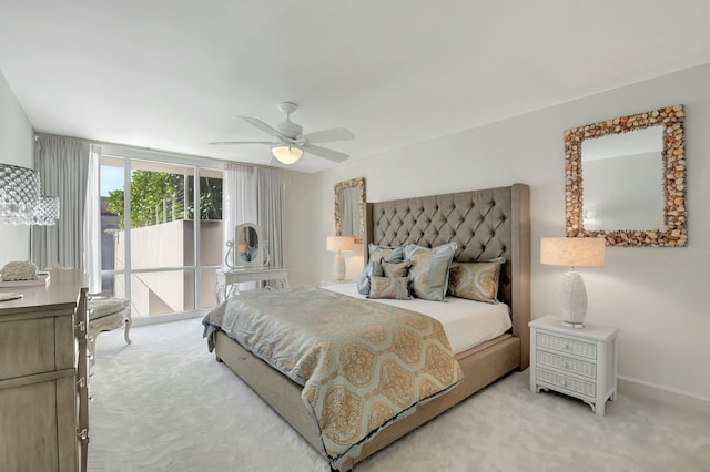 bedroom featuring light carpet, access to outside, a ceiling fan, and baseboards