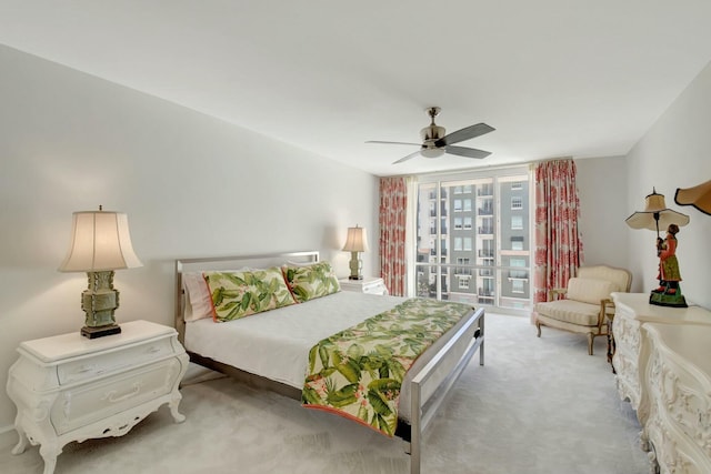 bedroom featuring light carpet and ceiling fan