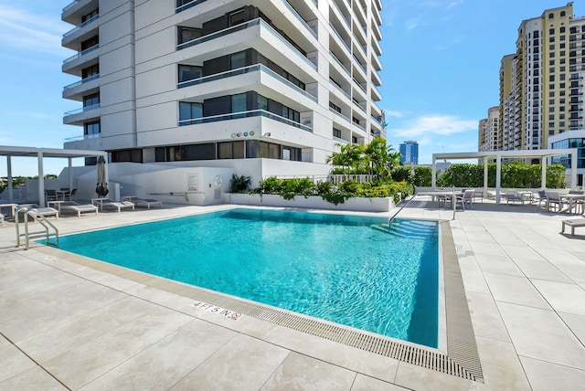 pool featuring a patio and a city view