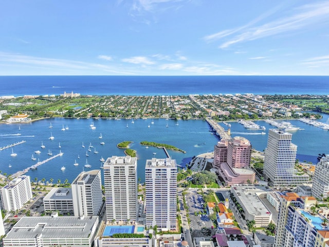 bird's eye view featuring a water view and a city view