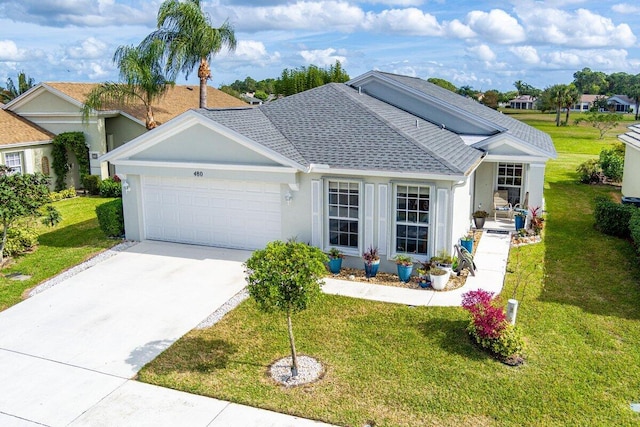 ranch-style home with a front lawn and a garage