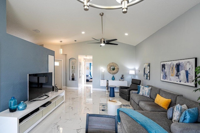 living room with a textured ceiling, ceiling fan, and lofted ceiling