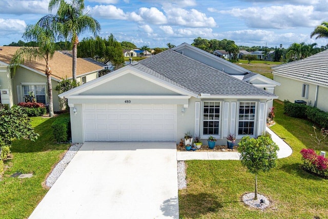 ranch-style house featuring a front lawn and a garage