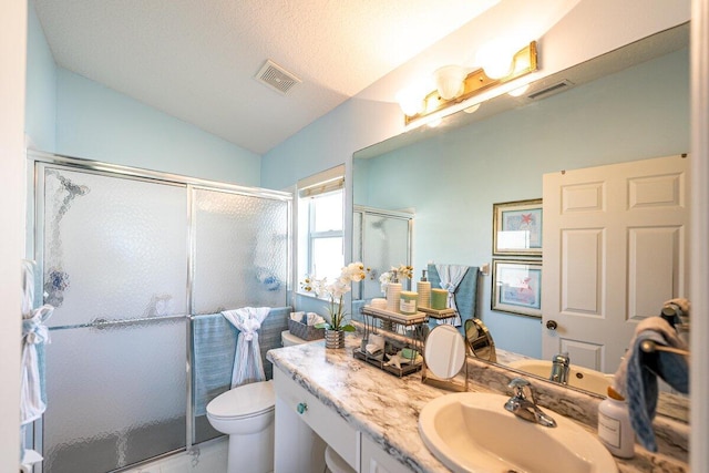 bathroom featuring vanity, lofted ceiling, toilet, a textured ceiling, and an enclosed shower