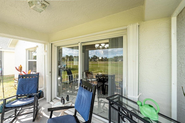 sunroom with an inviting chandelier