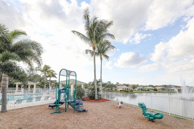 view of play area with a water view and a community pool