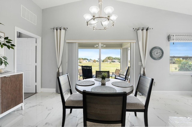 dining room featuring a chandelier and lofted ceiling