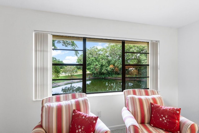 living area featuring a water view