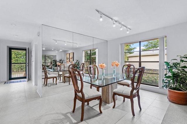 dining space featuring track lighting