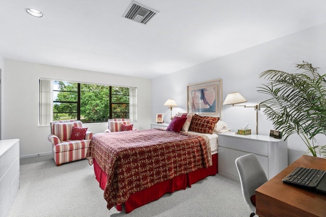 bedroom with light colored carpet