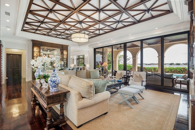 living room featuring hardwood / wood-style floors and crown molding