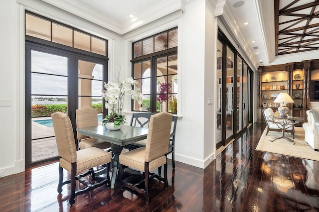 dining area featuring crown molding, french doors, and dark wood-type flooring