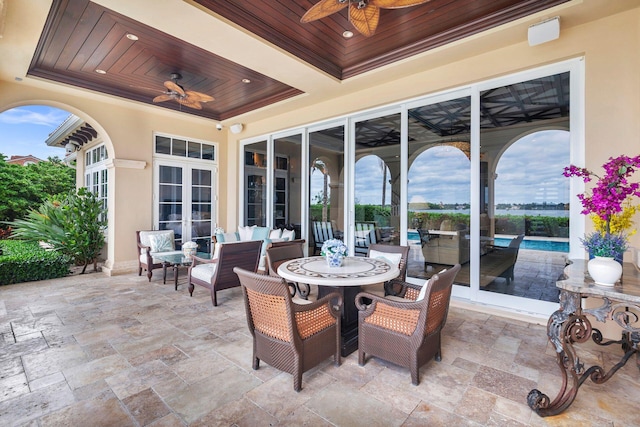 view of patio / terrace featuring french doors and ceiling fan