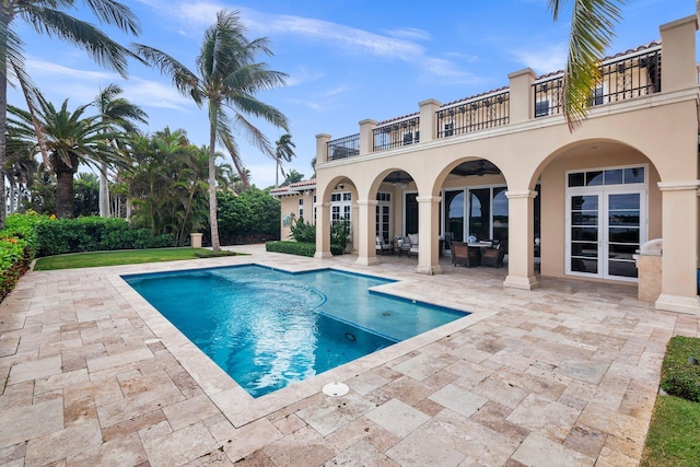 view of swimming pool with a patio area