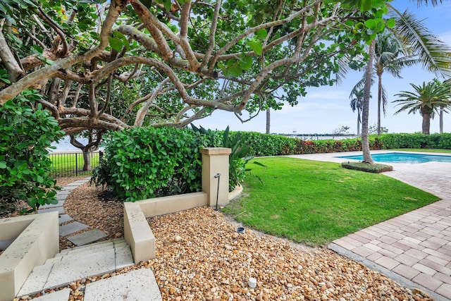 view of yard with a fenced in pool