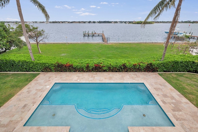 view of swimming pool featuring a boat dock, a water view, and a yard