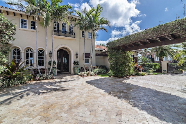 view of front of property with a balcony