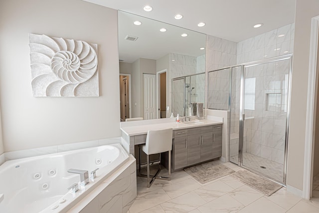 bathroom featuring vanity and separate shower and tub