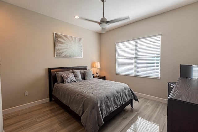 bedroom featuring ceiling fan and wood-type flooring