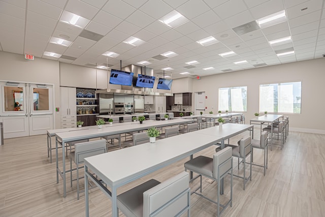 kitchen featuring a drop ceiling and built in refrigerator