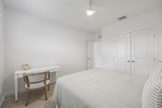 bedroom featuring ceiling fan, carpet floors, and a closet