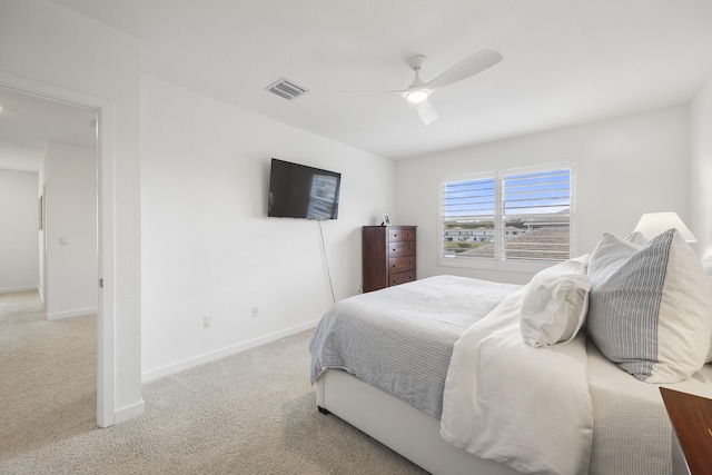 bedroom with ceiling fan and carpet floors