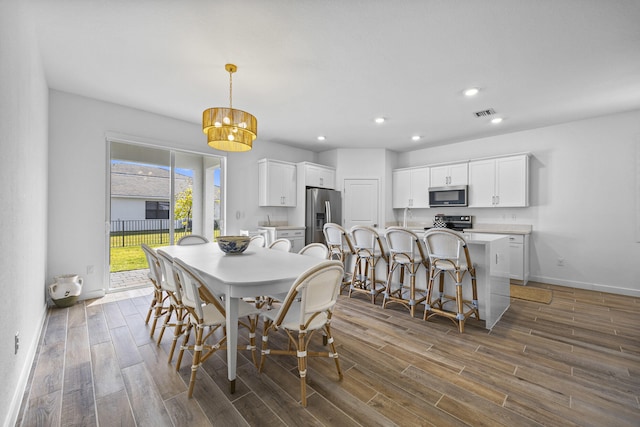 dining room with dark hardwood / wood-style flooring