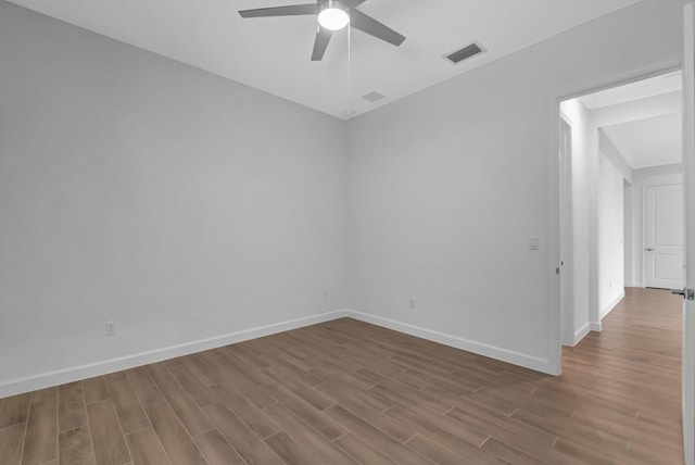 empty room with wood-type flooring and ceiling fan