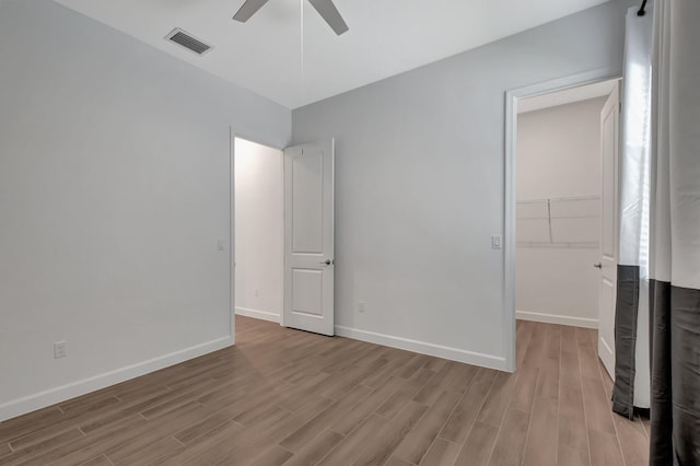 unfurnished bedroom featuring ceiling fan and light wood-type flooring