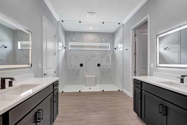 bathroom with crown molding, vanity, and a shower with shower door