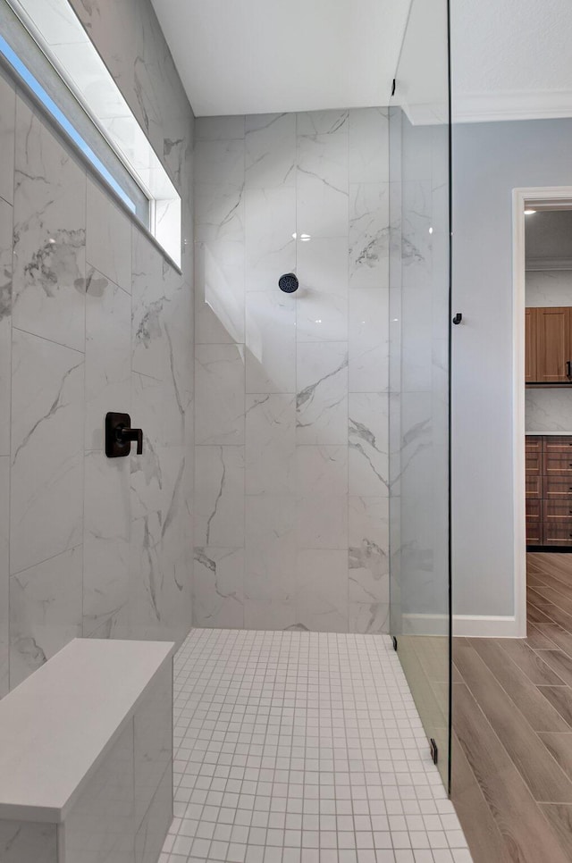 bathroom featuring a tile shower