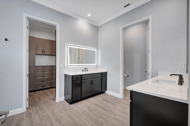 bathroom featuring vanity and crown molding