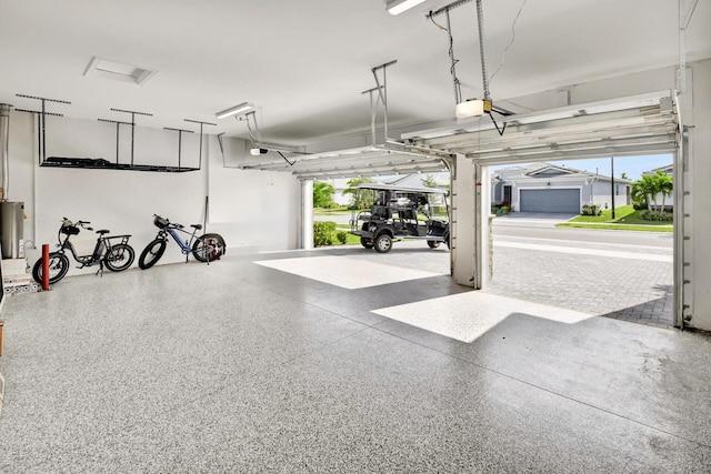 garage with a garage door opener and water heater