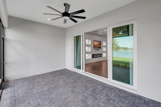 view of patio / terrace featuring ceiling fan