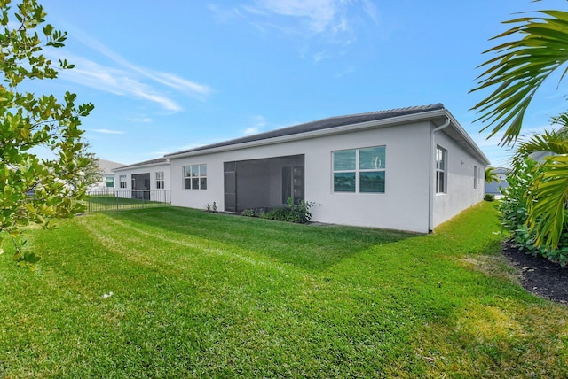 back of house with a yard