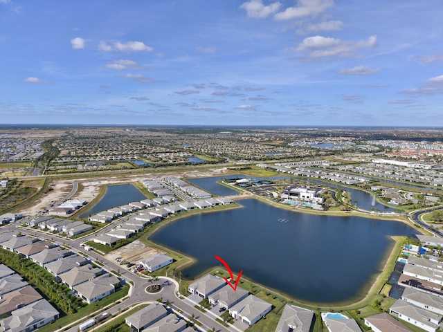 birds eye view of property featuring a water view