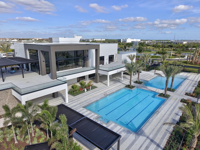 view of swimming pool with a patio