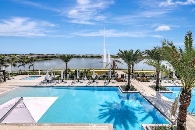 view of pool featuring a water view