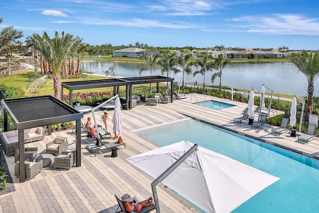 view of pool featuring a gazebo, a water view, and an outdoor living space